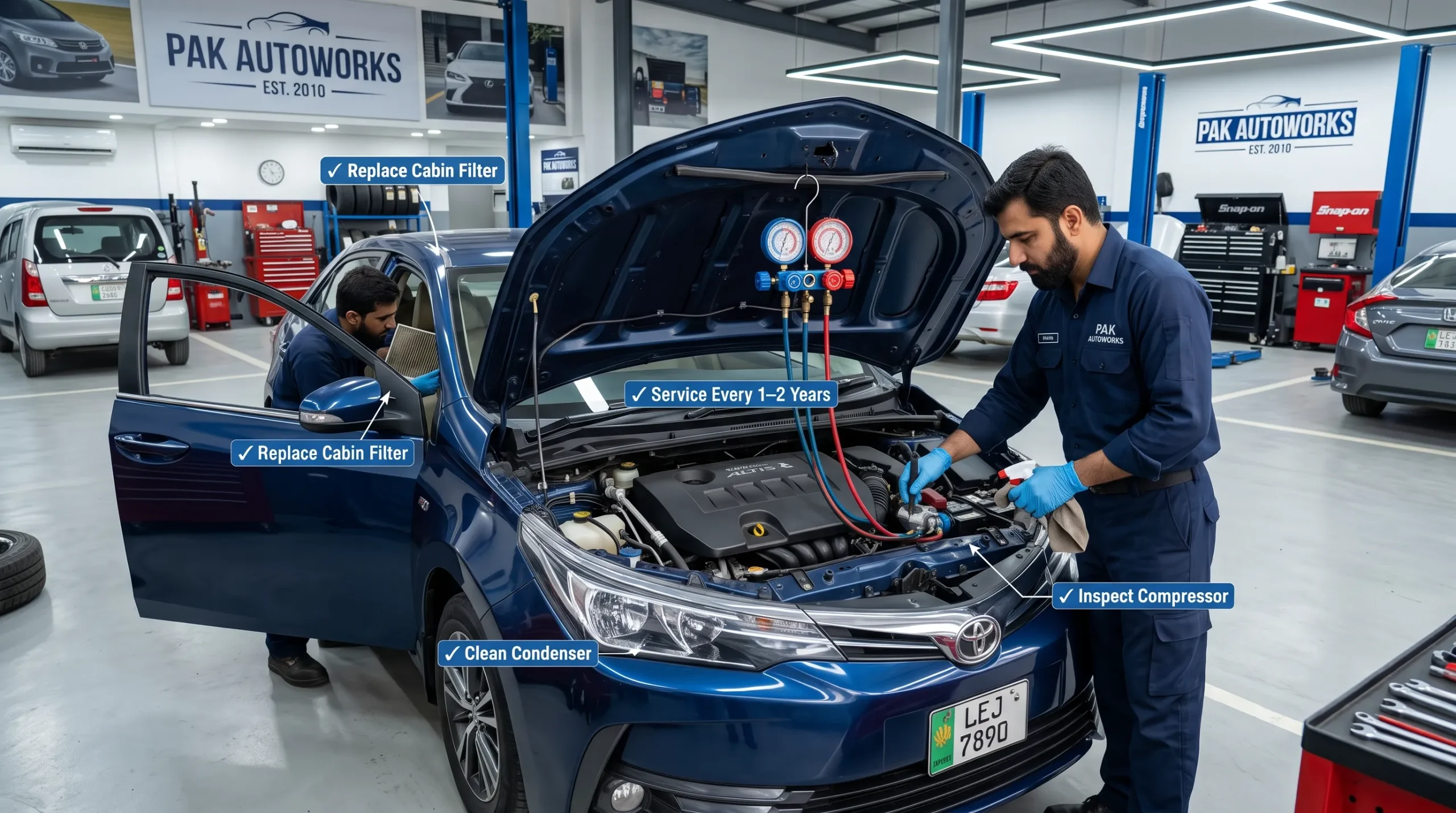 Mechanic servicing a car air conditioning system