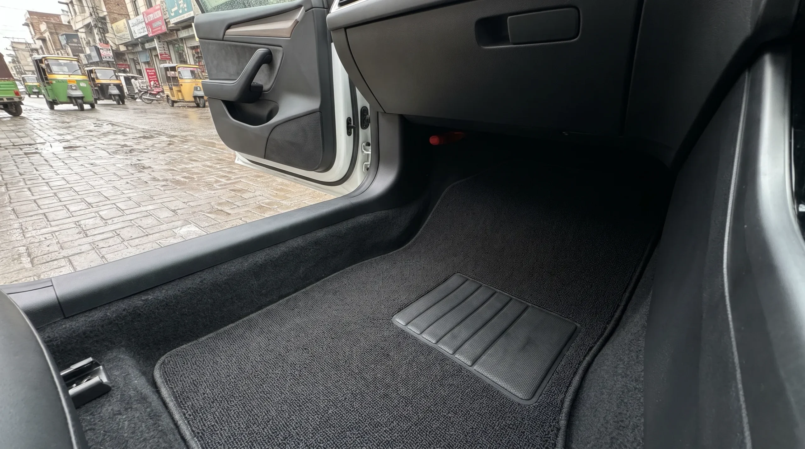 Clean dry car floor mats inside a car after rain scaled