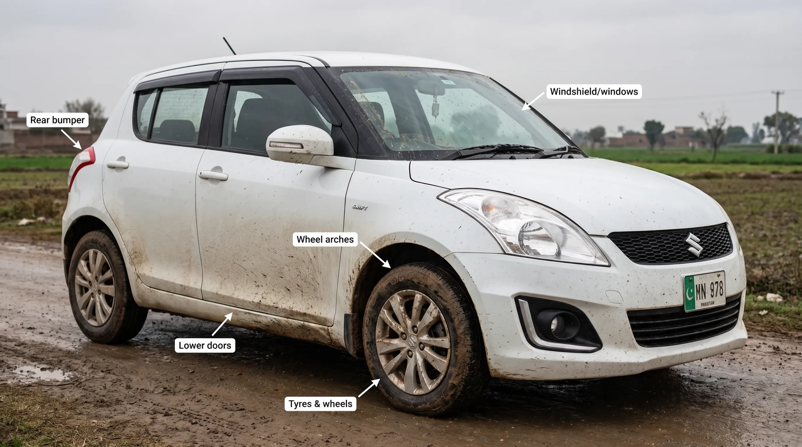 Car driving through muddy rainwater and road spray during Pakistan monsoon